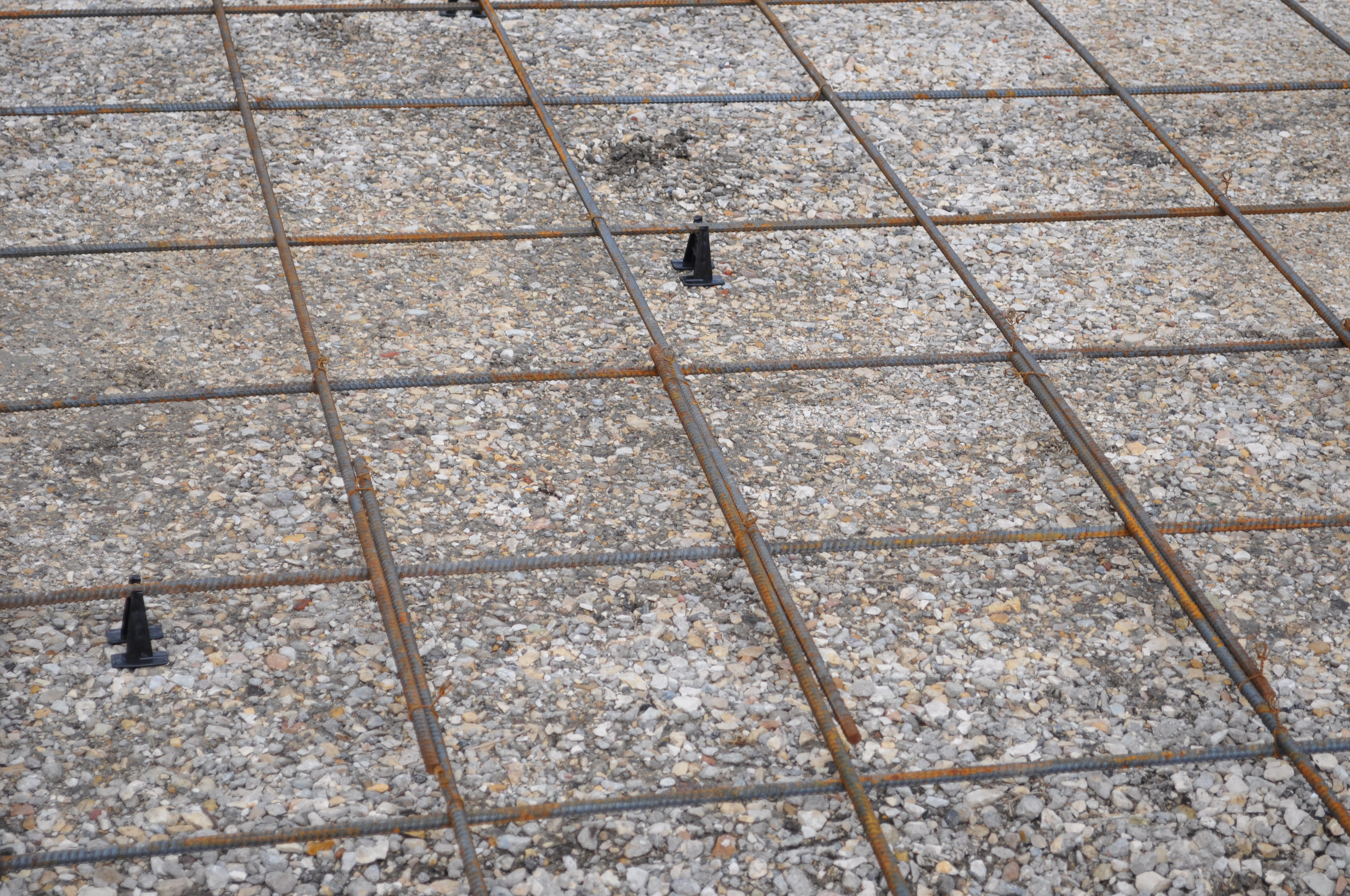 Rebar on chairs over gravel base before concrete pour