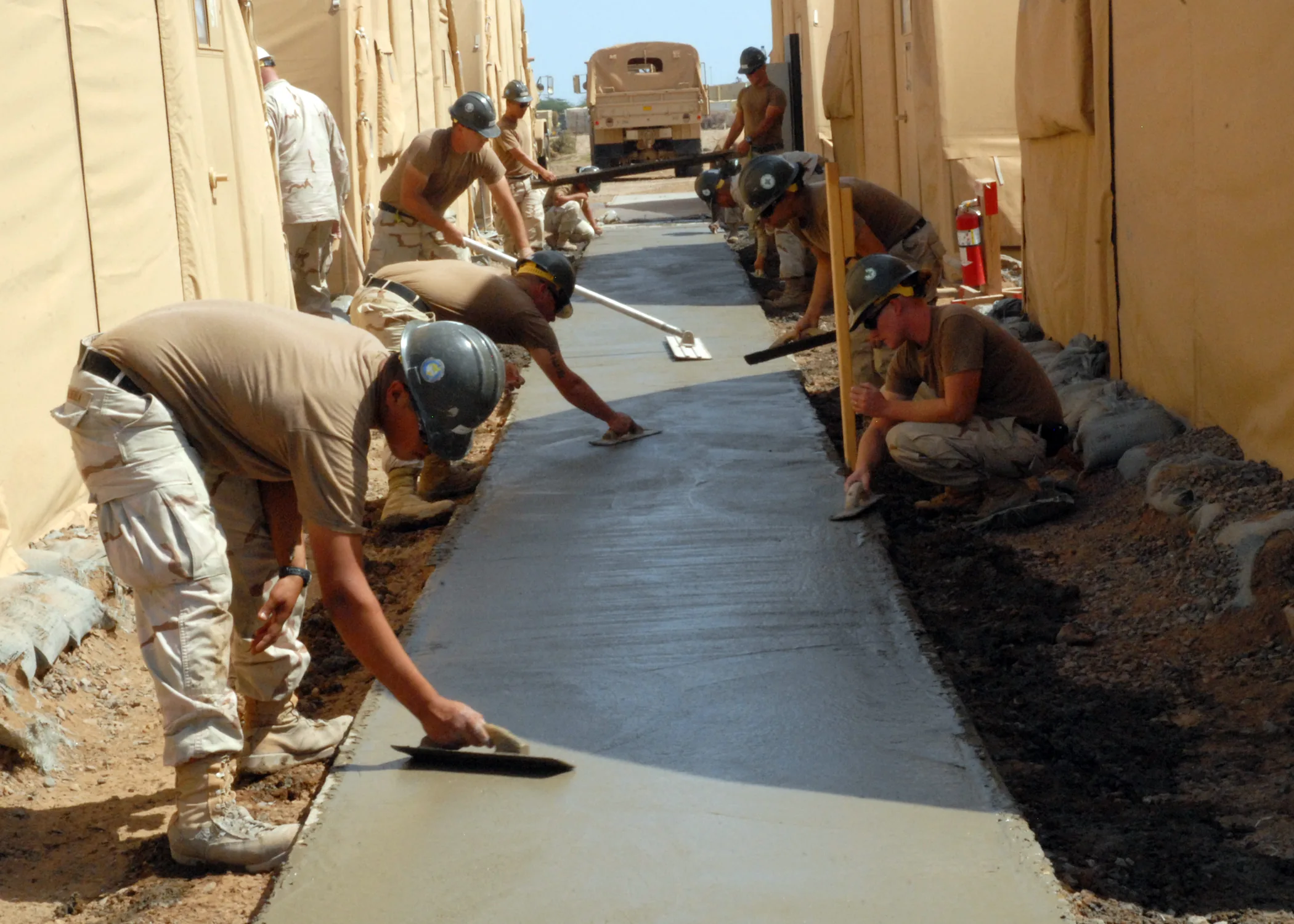 Fresh concrete flatwork being finished