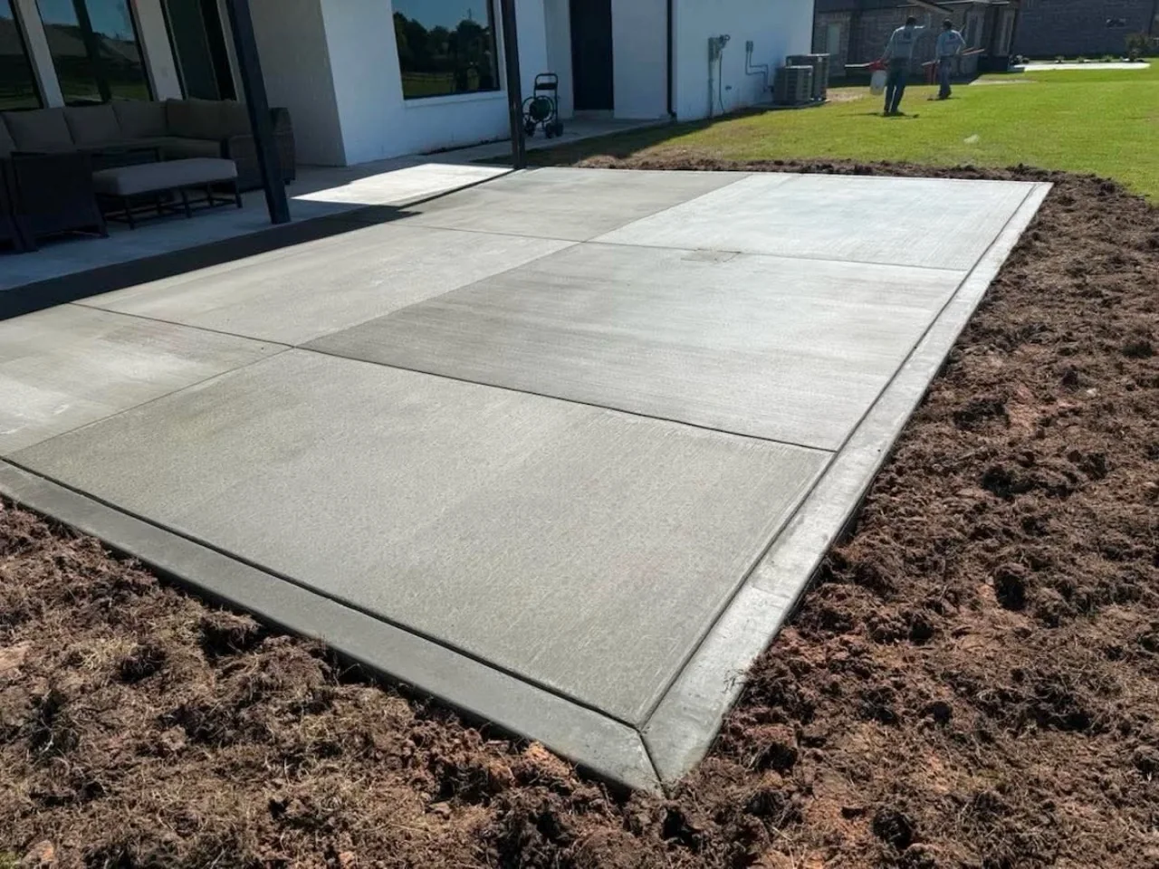 Finished concrete patio and flatwork at a home